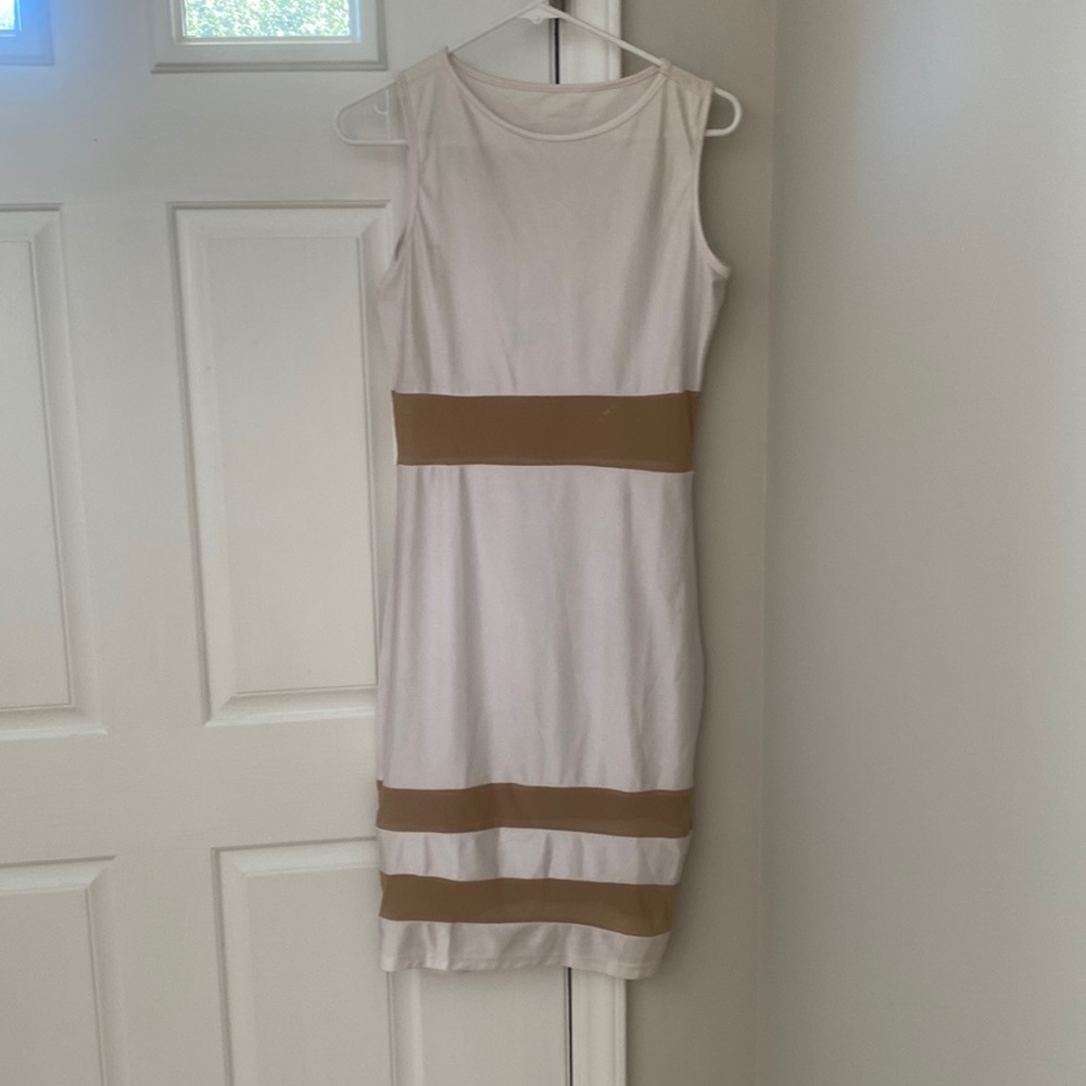 White dress with sheer design around waist and thighs.